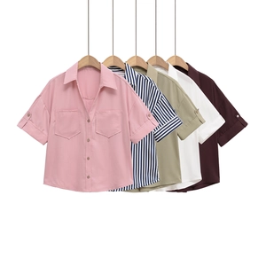 Detail of multi-color French style short sleeve shirts with lapel collar and double pockets