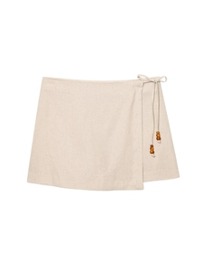 Beige wrap mini skirt with cotton linen texture and decorative beaded waist tie