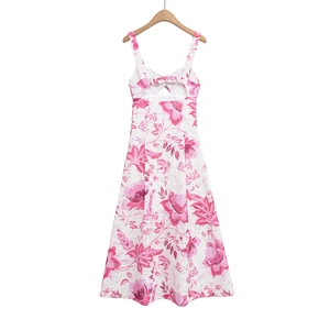 Detail of floral eyelet lace fabric and back cut-out with knot on a summer sundress