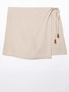 Beige wrap skirt with waist tie and dark brown wooden beads in bohemian style