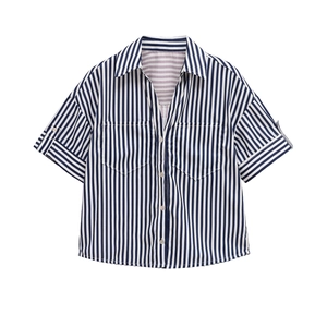 Detail of blue and white striped short sleeve shirt featuring front flap pockets
