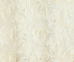 Macro detail of 3D mesh rose fabric on an ivory sleeveless maxi dress