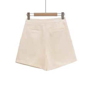 Detail of off-white high-waisted cotton linen shorts with decorative back welt pockets