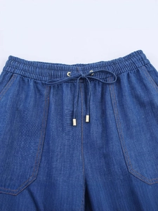 Deep blue high-waisted harem pants with drawstring elastic waist and contrast stitching