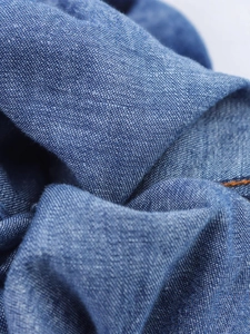 Deep blue drawstring harem pants in premium woven fabric with a soft textured finish