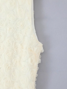 Elegant white maxi dress featuring 3D floral rosettes and slim sleeveless silhouette