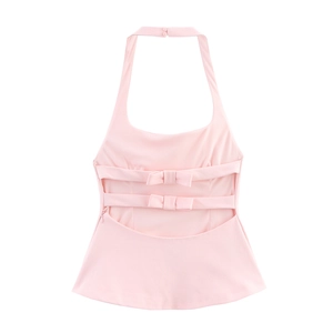 Detailed back view of pink halter top showing elegant bow ties and ruffled hemline