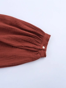 Rust red long sleeve embroidery dress featuring ruffled cuffs and cotton linen texture