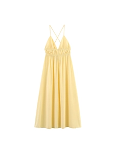 Elegant light yellow backless maxi dress with V-neckline and high-waisted smocked detail