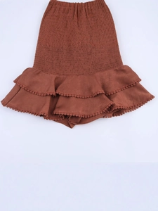 Y2K high waisted tiered skort with smocked waist and delicate lace trim in brick red