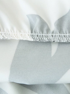 Detailed macro view of the floral print fabric and high-quality edge stitching finish