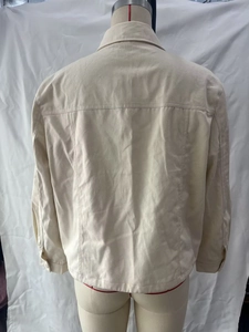 Back view of a cream French vintage denim jacket featuring collar and back seam details