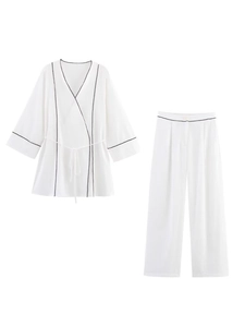 Women white casual two-piece set with long sleeve wrap top and wide leg pants with black trim