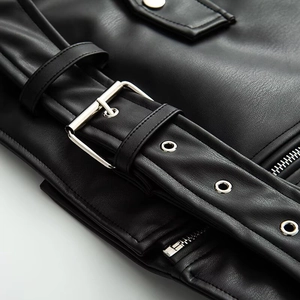 Detail of faux leather jacket with metal buckle belt and silver zipper texture
