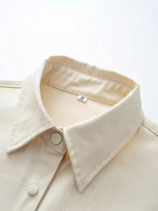 French vintage beige utility jacket with a refined lapel and matte button details