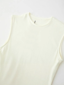 Women's minimalist sleeveless crew neck dress in cream ribbed knit with belt detail