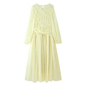Detailed view of the elegant pleated yellow chiffon dress with lantern sleeves and mesh stitching