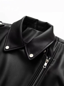 Women's black faux leather biker jacket with wide lapels and metallic zipper details