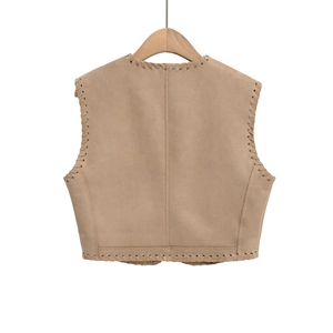 Detail of light khaki suede vest featuring decorative whipstitch embroidery on edges