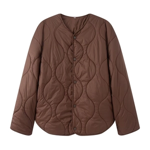 Detail of dark brown diamond quilted texture and button closure on liner jacket