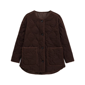 Detail view of dark brown quilted jacket featuring onion stitch pattern and large pockets