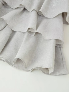 Silver-gray layered ruffle mini dress with metallic sheen for a stylish summer party look