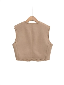 Retro light brown faux suede vest with contrast stitching and minimal tailoring on a hanger