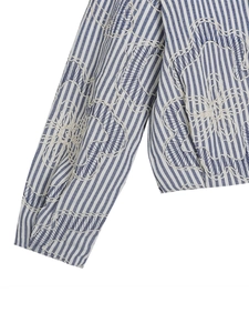 Classic blue and white striped bomber jacket with large white floral embroidery detail