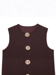 Deep burgundy sleeveless vest top with gold shell buttons and textured retro fabric