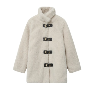 Detail of faux shearling coat with stand collar and elegant black leather buckles