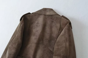 Detailed view of brown faux suede texture on motorcycle jacket shoulders and collar