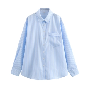 Detail of blue and white striped cotton shirt showing collar, chest pocket and button layout