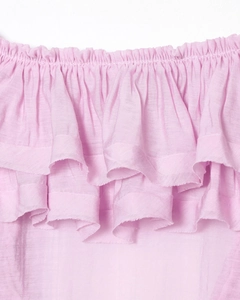 Macro detail of French style layered chiffon blouse featuring pleated ruffles and textures