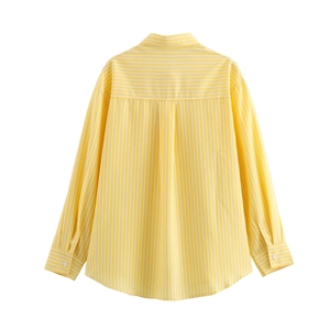 Detail view of back inverted pleat on a yellow striped long sleeve casual shirt