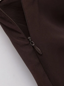 Detailed close-up showing the high-quality invisible zipper on chocolate midi skirt