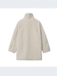 Minimalist beige lamb wool coat with a high collar and warm textured fleece material