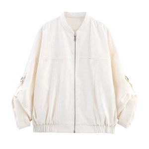 Short cream baseball jacket with metallic buckle strap details on sleeves and zipper
