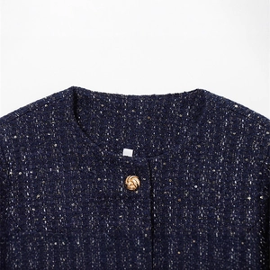 Classic navy tweed jacket with subtle gold sequins and vintage metallic button