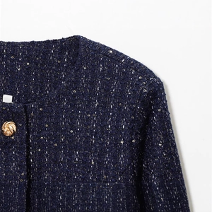 Women's navy tweed jacket with golden metallic threading and decorative textured buttons