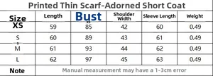 Size chart table for women's short trench coat with scarf detail, sizes XS to L