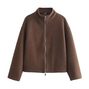 Detail of dark brown wool jacket featuring silver double zipper and standing collar