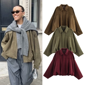 Detailed comparison of vintage oversized faux suede bomber jackets in green and brown