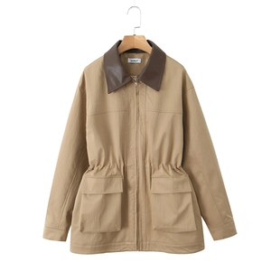 Detail view of khaki utility jacket featuring leather collar and drawstring waist