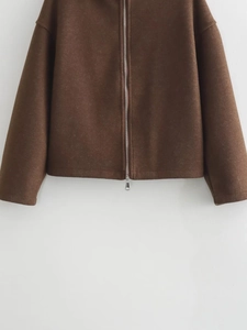 Detailed view of dark brown wool jacket with high-quality silver metal zipper