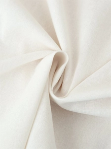 Macro shot of breathable ivory linen fabric texture with premium woven detail