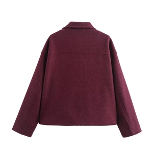 Detail of burgundy wool blend jacket back with horizontal stitching and dropped shoulders