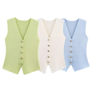 Close-up of V-neck knit vests showing textured vertical ribs and gold metallic buttons