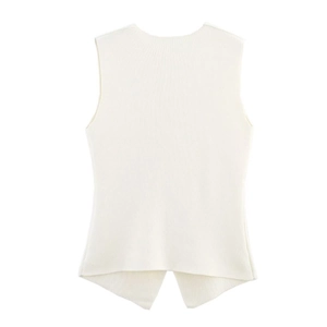 Detailed view of white knitted vest featuring a unique inverted V-shaped slit at the back hem