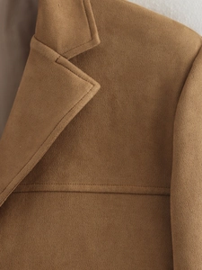 Close-up of suede blazer showing high-quality notched lapels and fine stitching detail