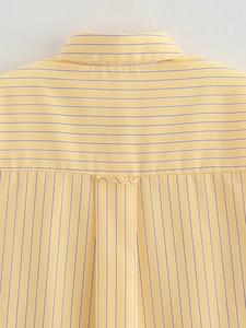 Detail of yellow striped shirt back yoke with vertical and horizontal pattern contrast